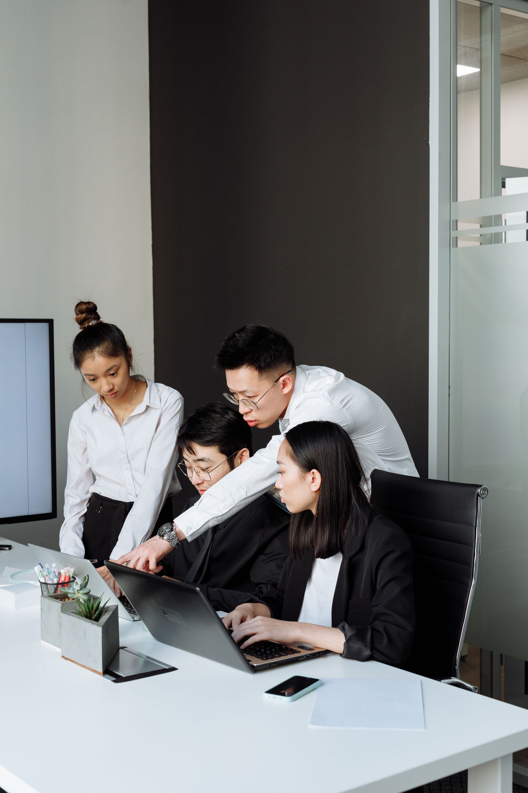 Technology consulting team reviewing documents together